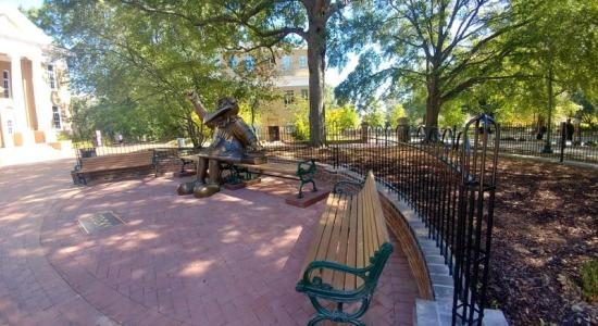 Powder coated benches and fence on a campus plaza